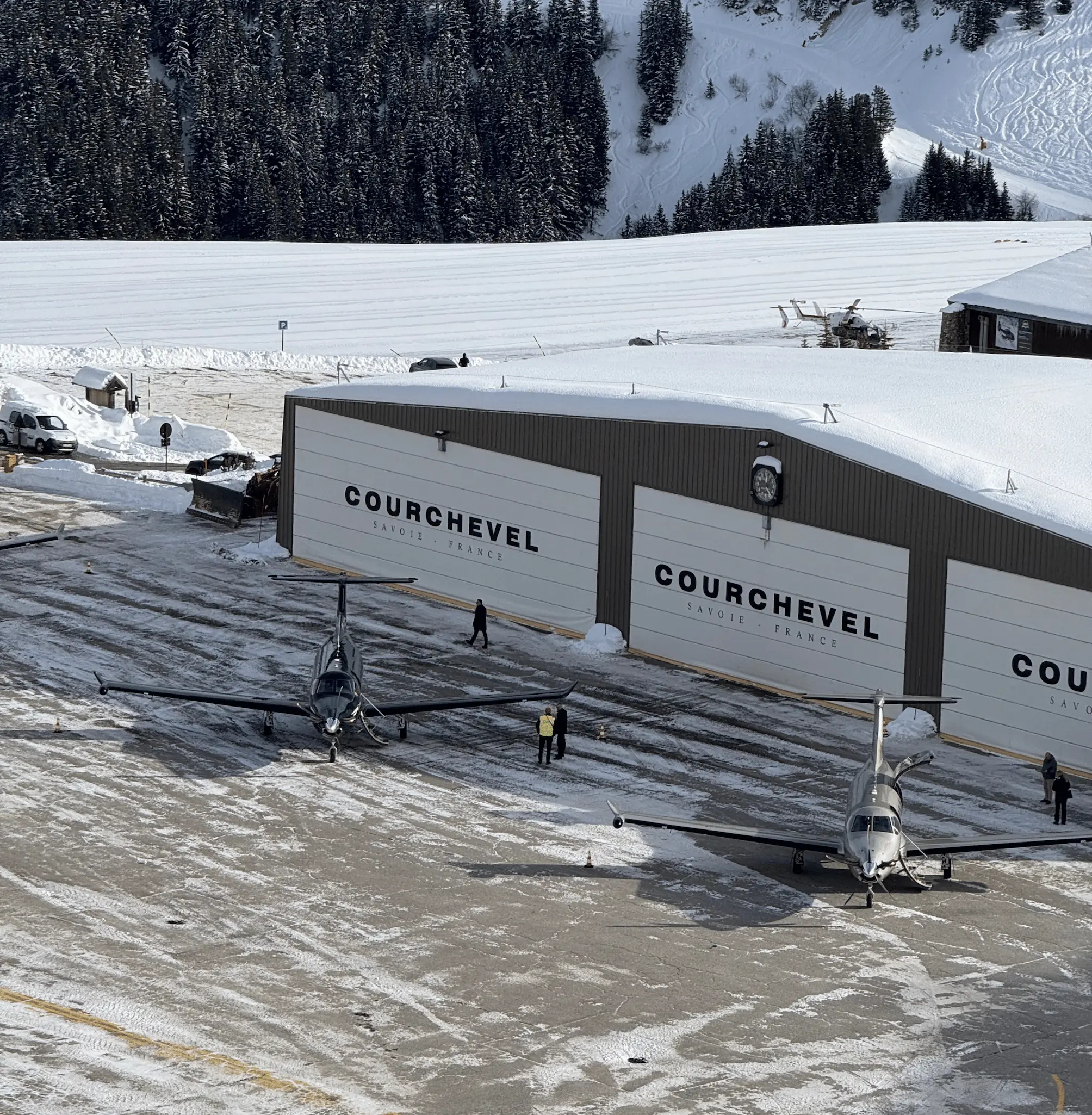 Private jet at Courchevel Altiport in snowy mountains