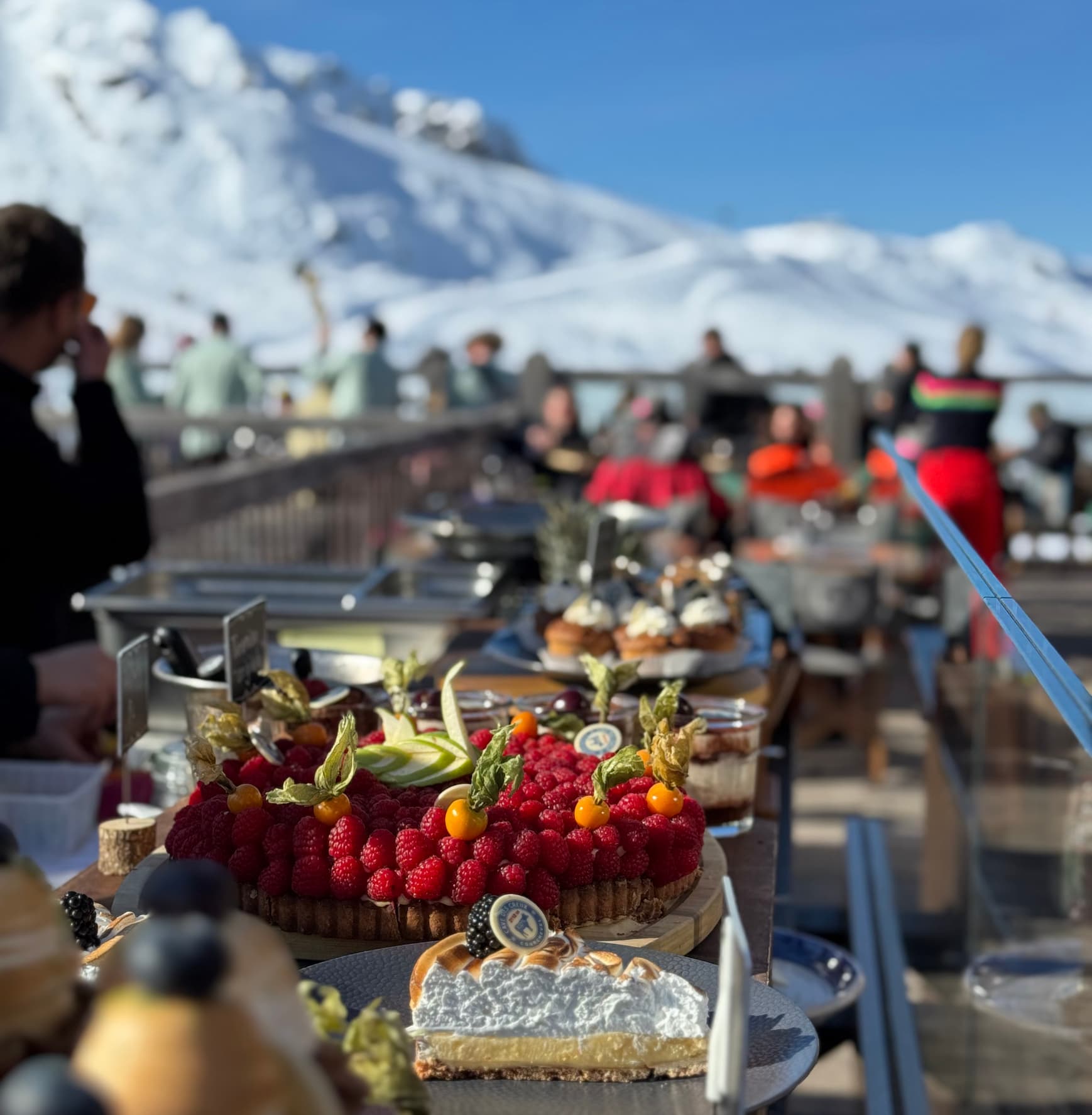 Mountain restaurant terrace in Courchevel with dessert buffet
