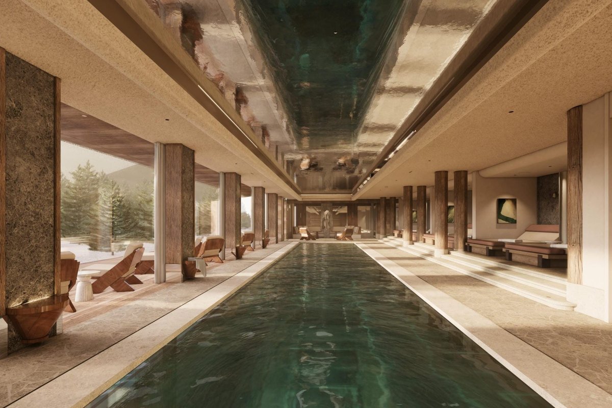 Long indoor pool lined with stone columns